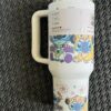 Cute animal-themed reusable tumbler with cartoon characters.