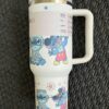 Cute Disney Stitch and Mickey Mouse travel mug with characters.