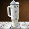 Cute tiki girl with tropical flowers and stars, travel tumbler with straw.