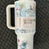 Colorful peace-themed tumbler with cartoon characters and inspirational quote.