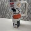 Colorful travel-themed coffee tumbler with funny quotes and quirky illustrations.