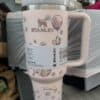 Stylish Stanley Quencher Tumbler with floral design, perfect for peace and love themes.