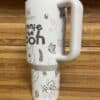 Cute Winnie the Pooh themed travel mug with cartoon characters and nature illustrations.