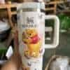 Insulated Winnie the Pooh tumbler featuring Honey Pot and butterfly details, perfect for tea lovers.