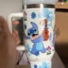 Colorful Stitch and guitar travel mug, Disney-themed design.