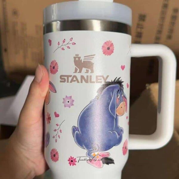 Cute cartoon horse travel mug with floral design and Stanley logo.