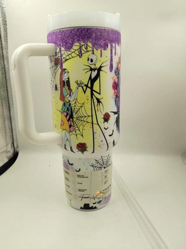 Colorful Halloween-themed coffee mug with spooky characters and pumpkins.
