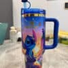 Colorful Disney Stitch travel mug with lid and character design.