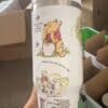 Cute Winnie the Pooh themed water bottle with inspirational quote.