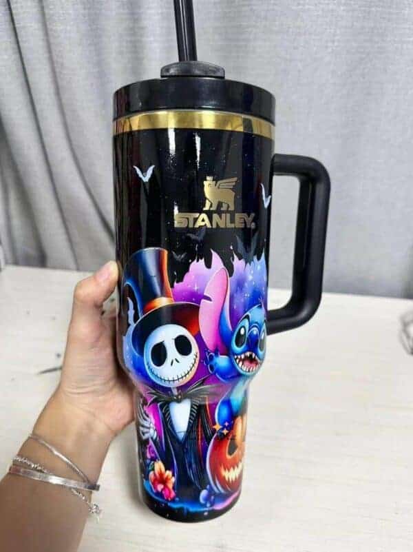 Colorful Halloween-themed travel mug featuring Jack Skellington and Stitch.