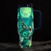 Bright glow-in-the-dark Stitch and skull design on insulated tumbler.