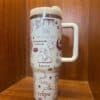 Colorful travel mug with versatile peace and love-themed illustrations.