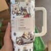 Cute Winnie the Pooh thermos with floral, bee, and forest design images.
