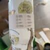 Eco-friendly travel mug with nature-themed design and illustrations.