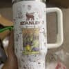 Bright white travel mug with bear illustrations and forest scene.