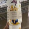 Colorful Winnie the Pooh drink cup with butterflies and floral design.