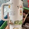 Cute bear with honey and bee illustrations, perfect for tea lovers.