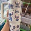 Colorful Stitch Disney character illustrations on travel mug for fans.