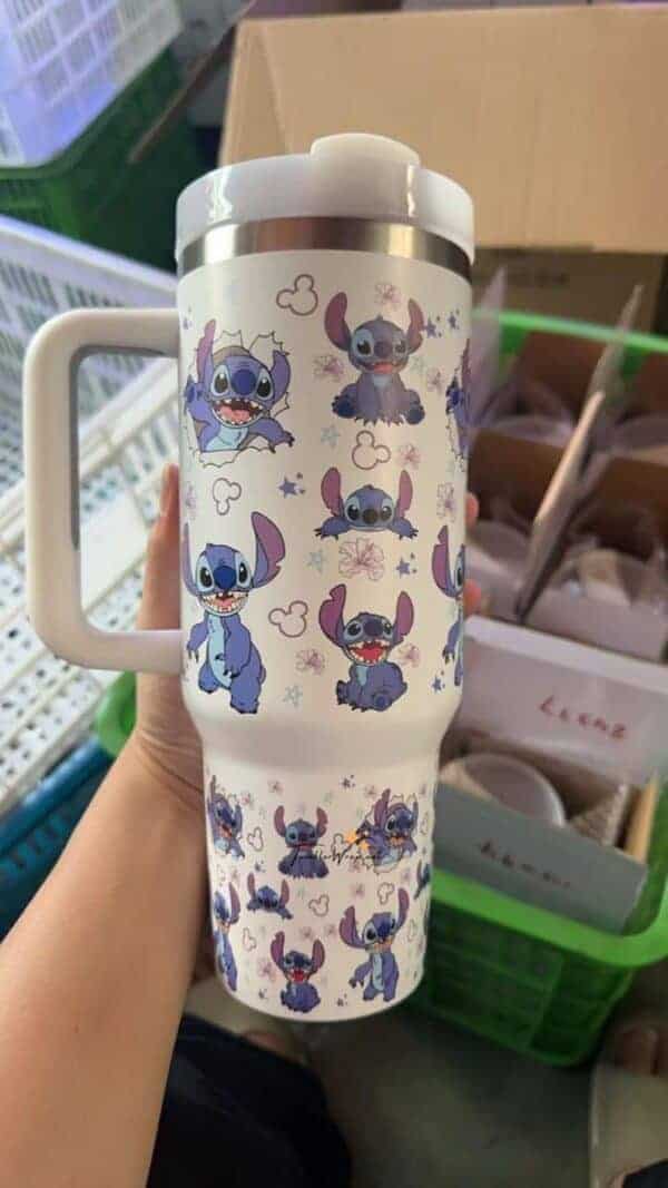 Colorful Stitch Disney character illustrations on travel mug for fans.