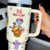 Colorful cartoon-themed mug with animals and the "Stanley" logo for peace.