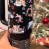 Festive Christmas mug featuring Winnie the Pooh, Piglet, and Eeyore in holiday theme.