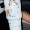 Winnie the Pooh with honey jar, adorable cartoon mug design.