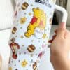 ALT: Winnie the Pooh themed tumbler with honey jars, Tigger, Piglet, and bear designs.