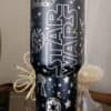 Star Wars-themed tumbler with iconic characters and space motifs, ideal for fans.
