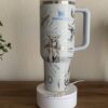 Thermos mug featuring peace and Stanley logos with artistic design.