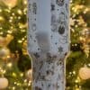 Cute Christmas-themed mug with Mickey Mouse and candy cane illustrations.