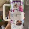 Spooky Halloween tumbler featuring cartoon monsters, bats, and haunted tree design.
