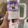 Colorful Halloween-themed Starbucks-style coffee mug featuring spooky illustrations.