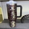 Insulated black travel mug featuring horror movie characters and quotes.