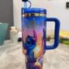 Colorful Stitch Disney travel tumbler with lid and straw.
