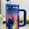 Colorful kids' travel mug with Stitch and butterfly designs.