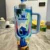 Colorful Stitch water bottle with Stanley logo.