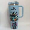 Bright blue mug featuring Halloween Stitch with bats, pumpkins, and skulls.