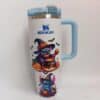 Cute witch and Halloween bat designs on travel mug.