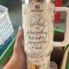Travel mug with Winnie the Pooh and Tigger design, motivational quote, and cute animal graphics.