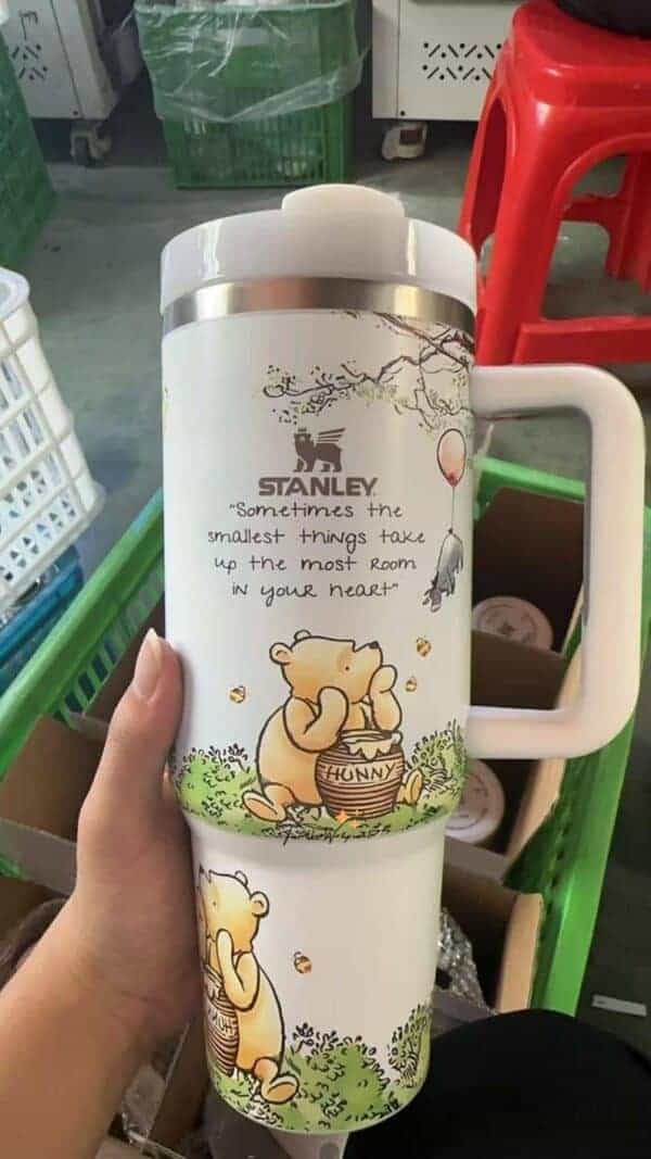 Whimsical bear design with quote about love and kindness.