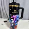 Colorful Halloween-themed Stanley tumbler with spooky characters and bats.