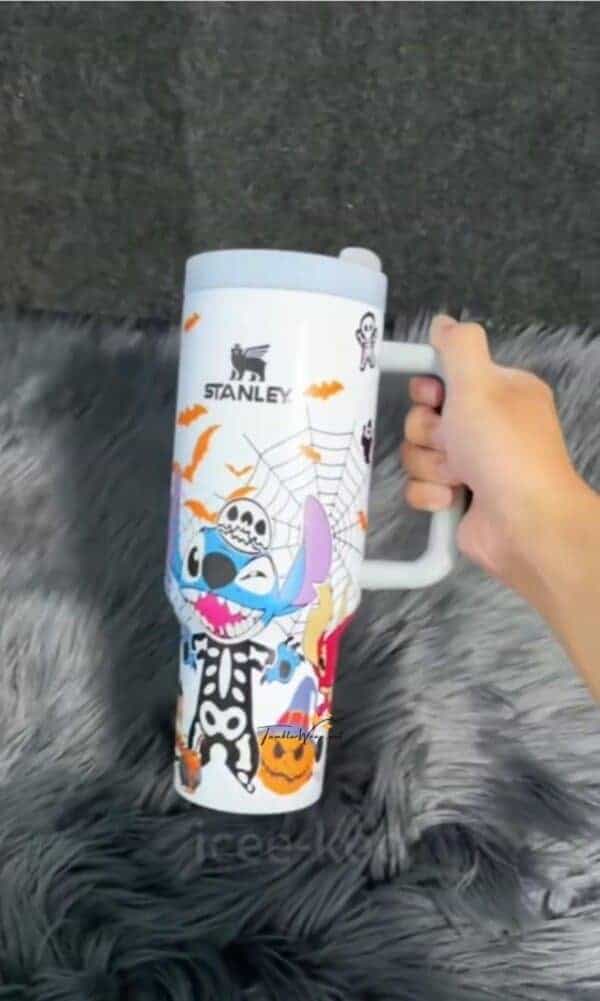 Cute Halloween themed coffee mug with spooky graphics.