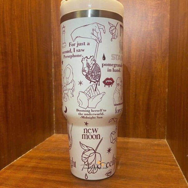 Decorative travel tumbler featuring peace, moon, and star designs.