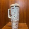 Elegant peace-themed thermos with artistic line drawings and text.