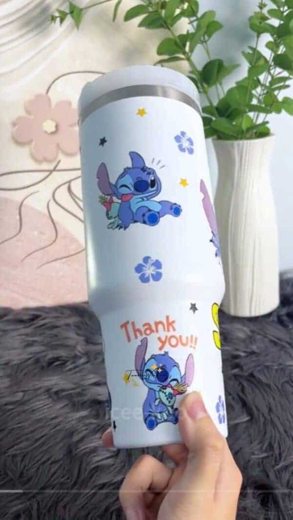 ALT: White tumbler with Stitch cartoon characters and "Thank you!!" text.