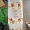 Cute Winnie the Pooh themed tumbler featuring adorable illustrations of Winnie the Pooh with honey and flowers.