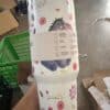 Adorable unicorn-themed water bottle with floral design and peace symbol.