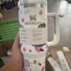 Cute floral-themed Stanley travel mug with whimsical design.