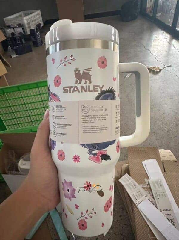 Cute floral-themed Stanley travel mug with whimsical design.