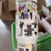Colorful Friends-themed water bottle with illustrations and positive messaging for fans.